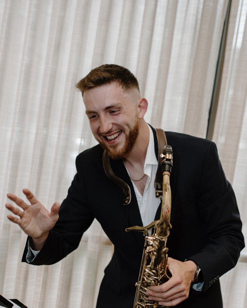 Dawson Bertrand holding his saxophone