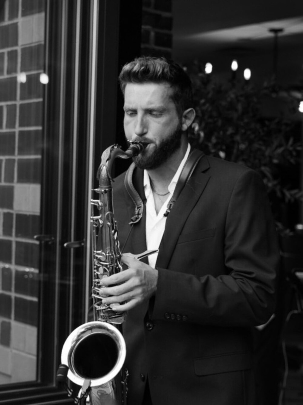 Dawson Bertrand, professional saxophonist, performing on his tenor saxophone