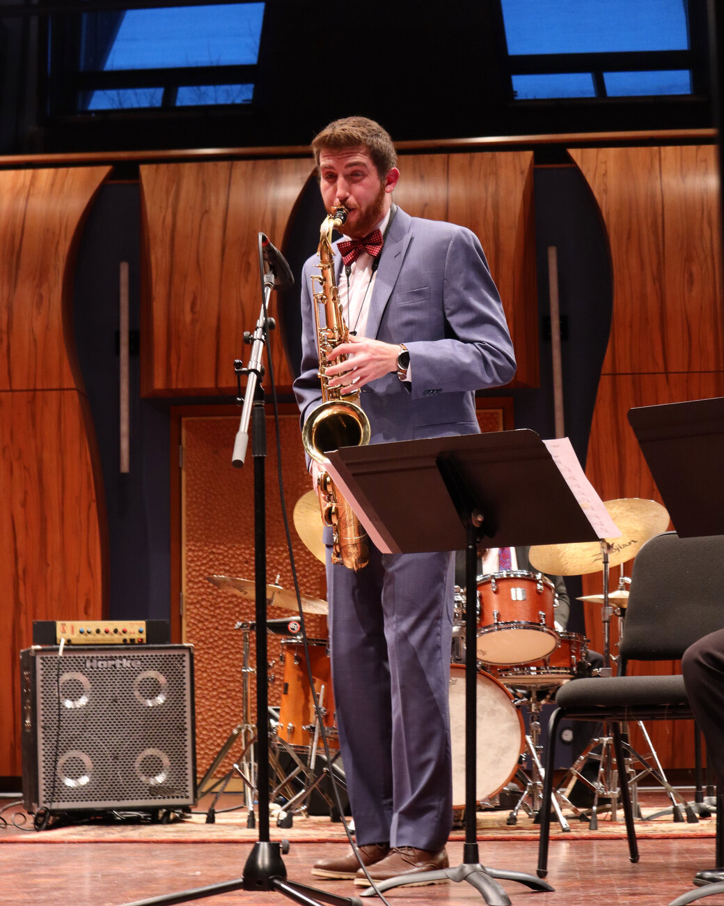 Dawson Bertrand performing live saxophone on stage at a public event