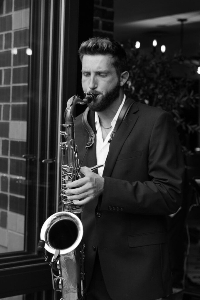 Dawson Bertrand performing live saxophone at a Sax and DJ event